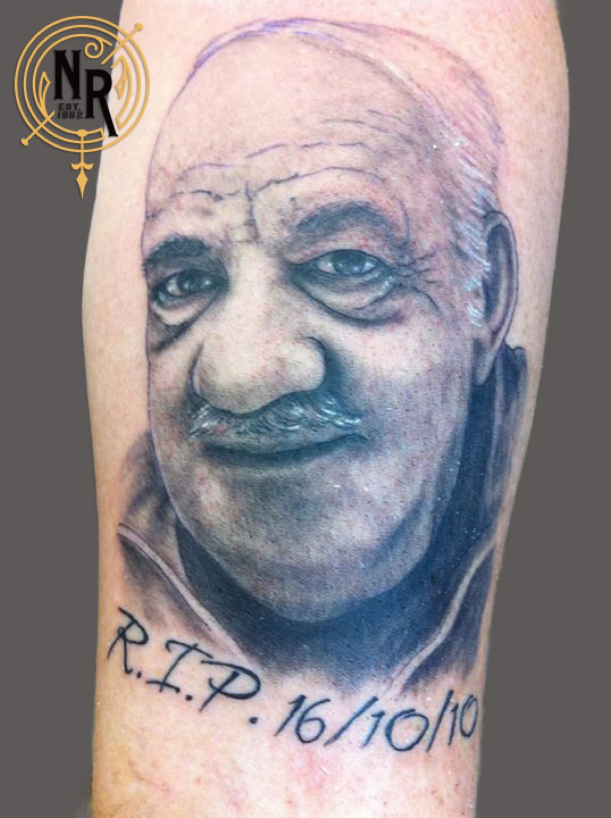 Black and grey memorial portrait tattoo